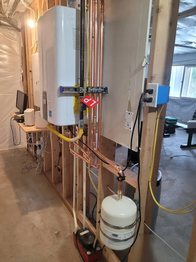 Licensed plumber repairing a kitchen sink in West Orange